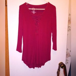 Cranberry tunic with criss cross pattern in front